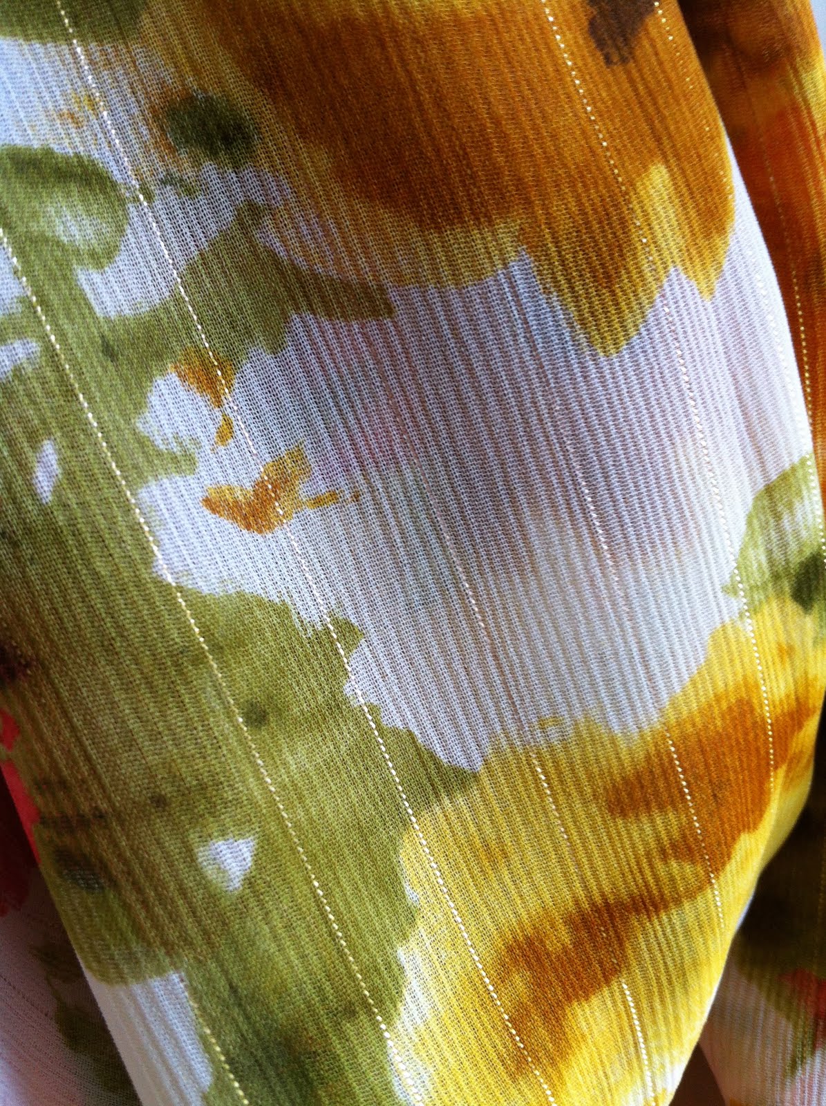 Close-up of the scarf in natural light showing the gold thread accent